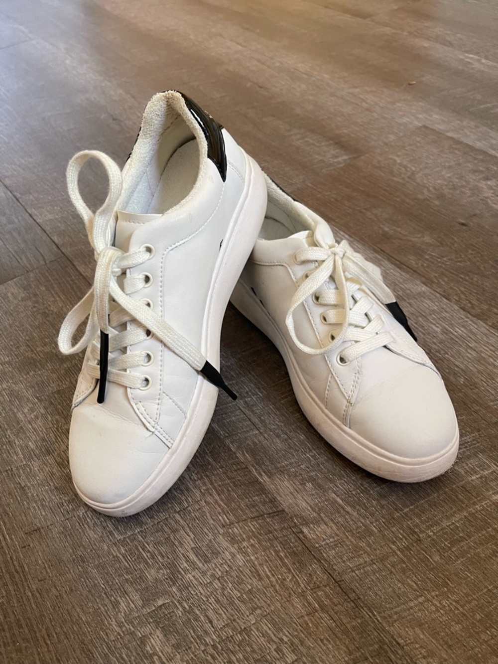 kate spade White Leather Low-Top Sneakers with Black Heel Accent